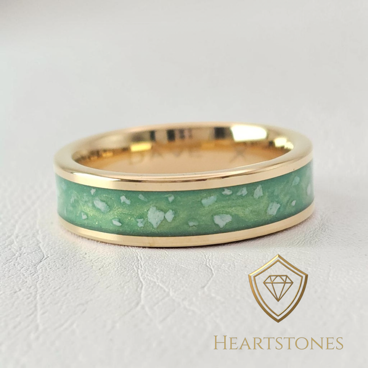 “Gold memorial band ring with green ash inlay, flush set and meticulously finished by hand by Heartstones®”