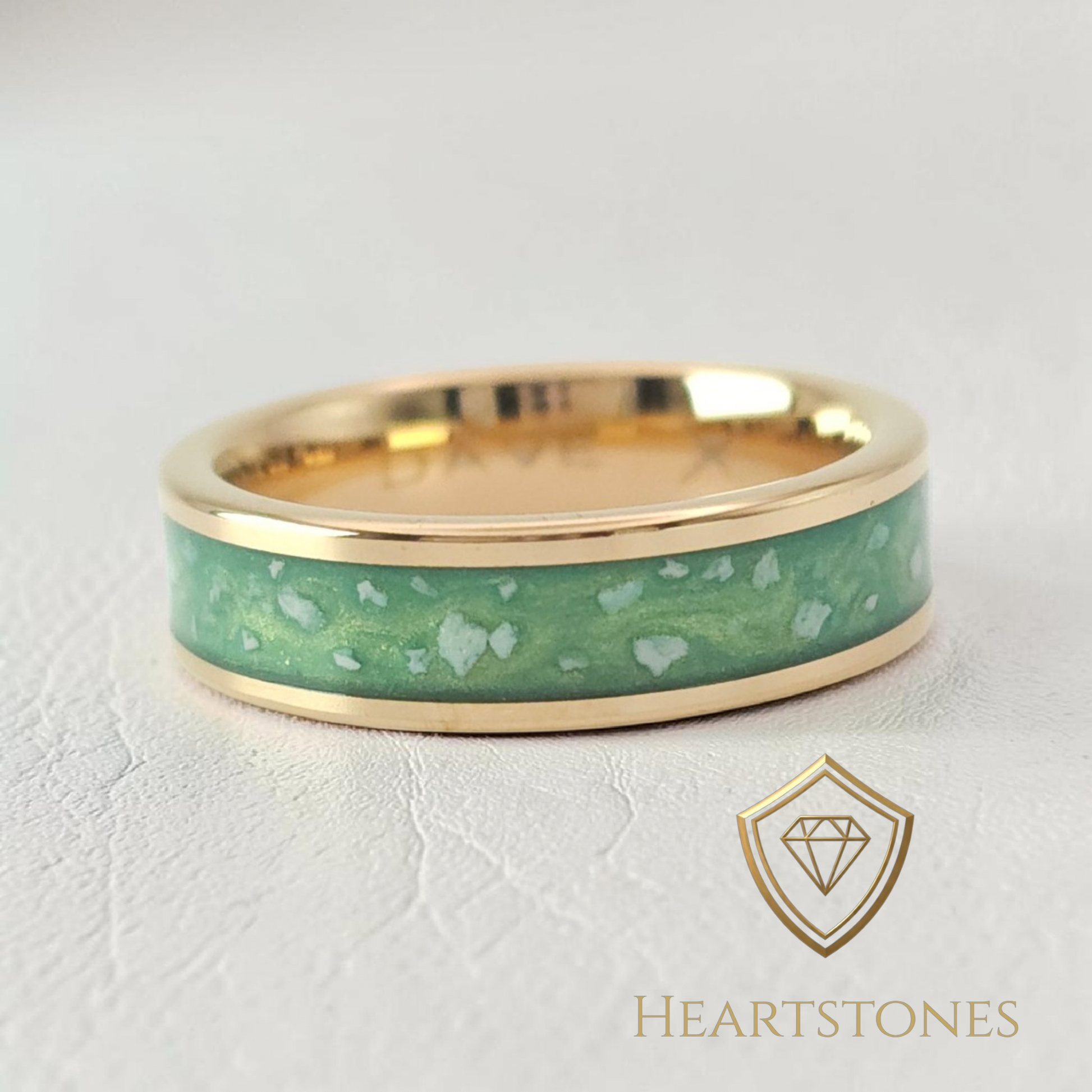 “Gold memorial band ring with green ash inlay, flush set and meticulously finished by hand by Heartstones®”