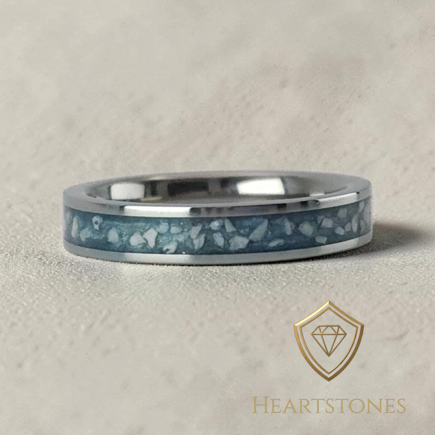 “Sterling silver memorial band ring with blue ash inlay, flush set and meticulously finished by hand by Heartstones®”
