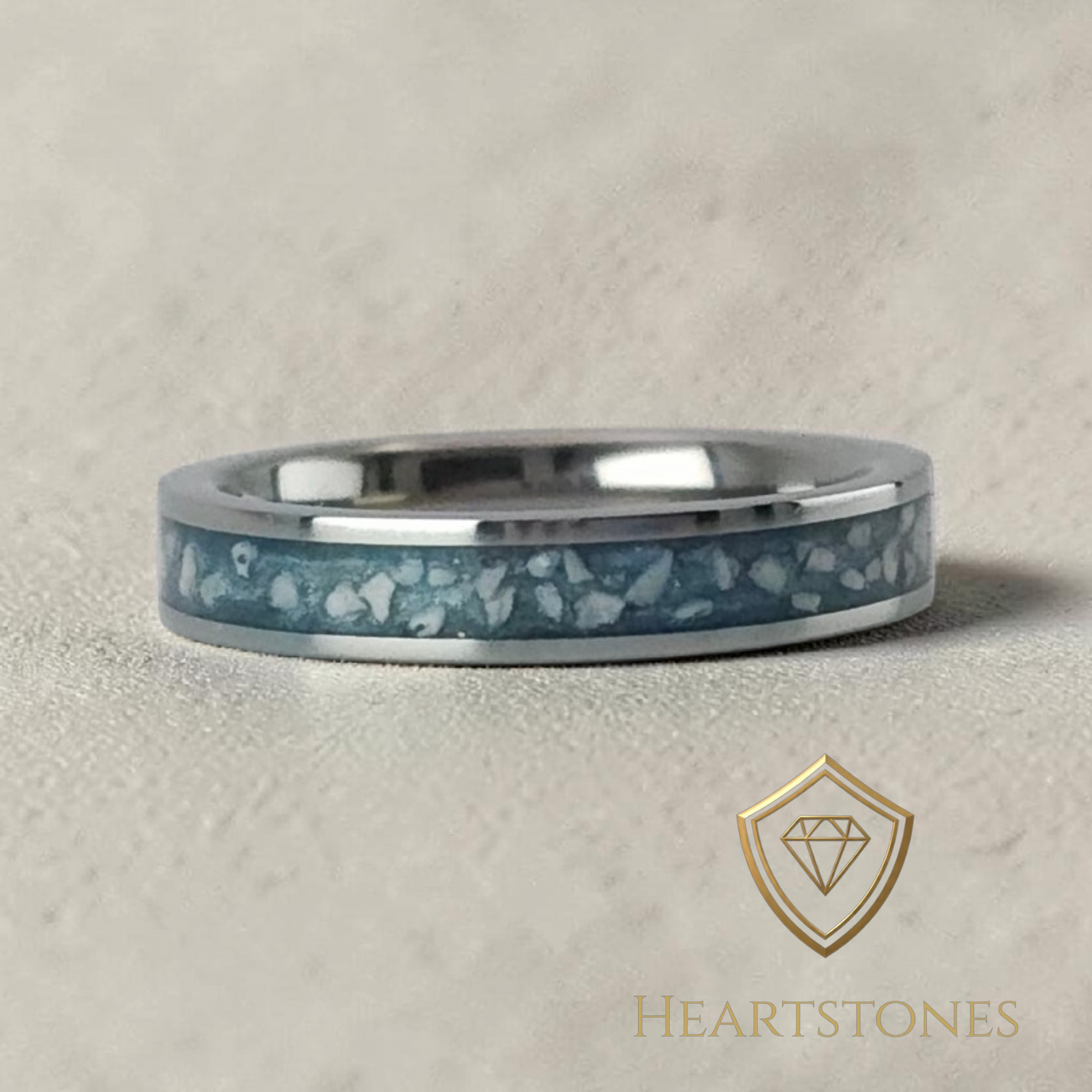 “Sterling silver memorial band ring with blue ash inlay, flush set and meticulously finished by hand by Heartstones®”