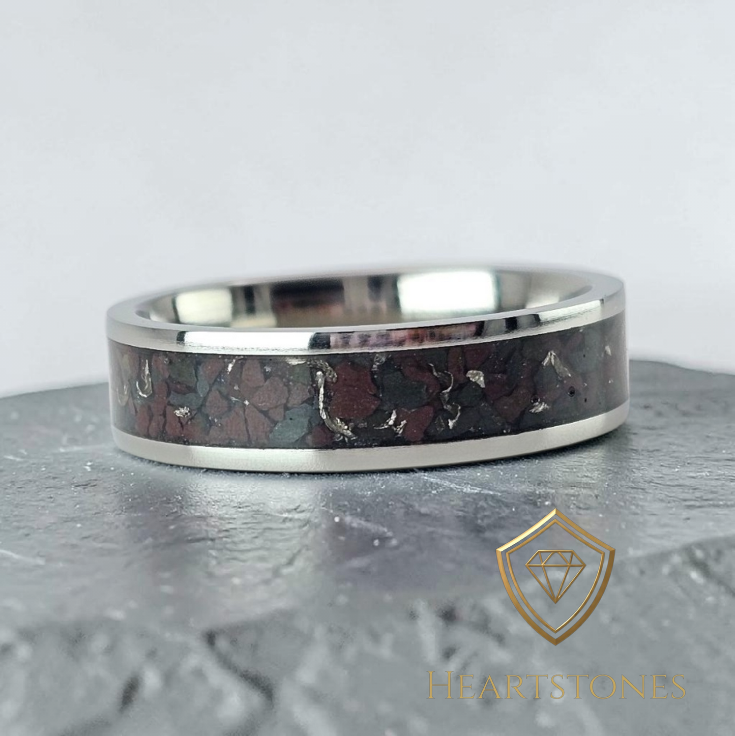 “Titanium memorial band ring with Welsh slate and sixpence shavings inlay, flush set and meticulously finished by hand by Heartstones®”