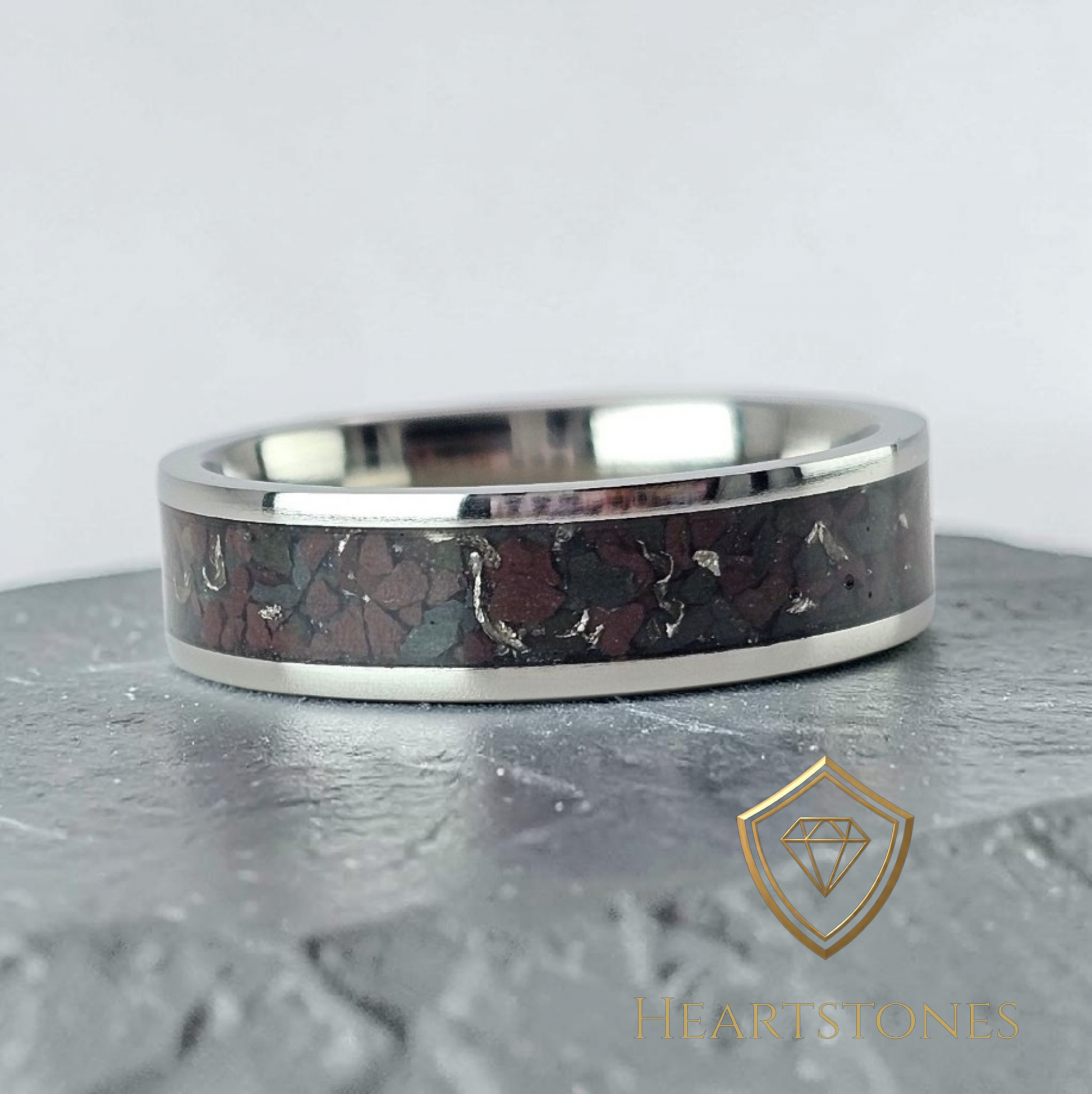“Titanium memorial band ring with Welsh slate and sixpence shavings inlay, flush set and meticulously finished by hand by Heartstones®”