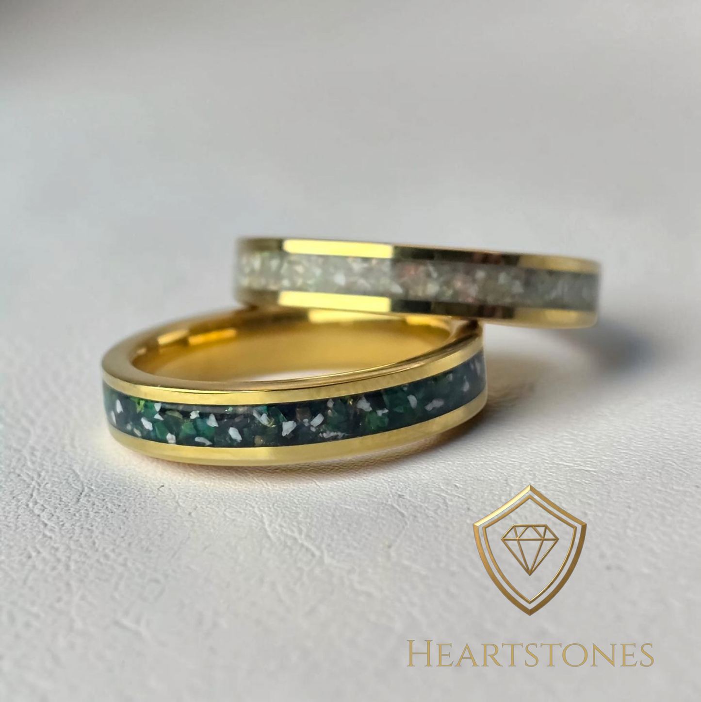 “Gold memorial band rings with green and white ash inlay, flush set and meticulously finished by hand by Heartstones®”