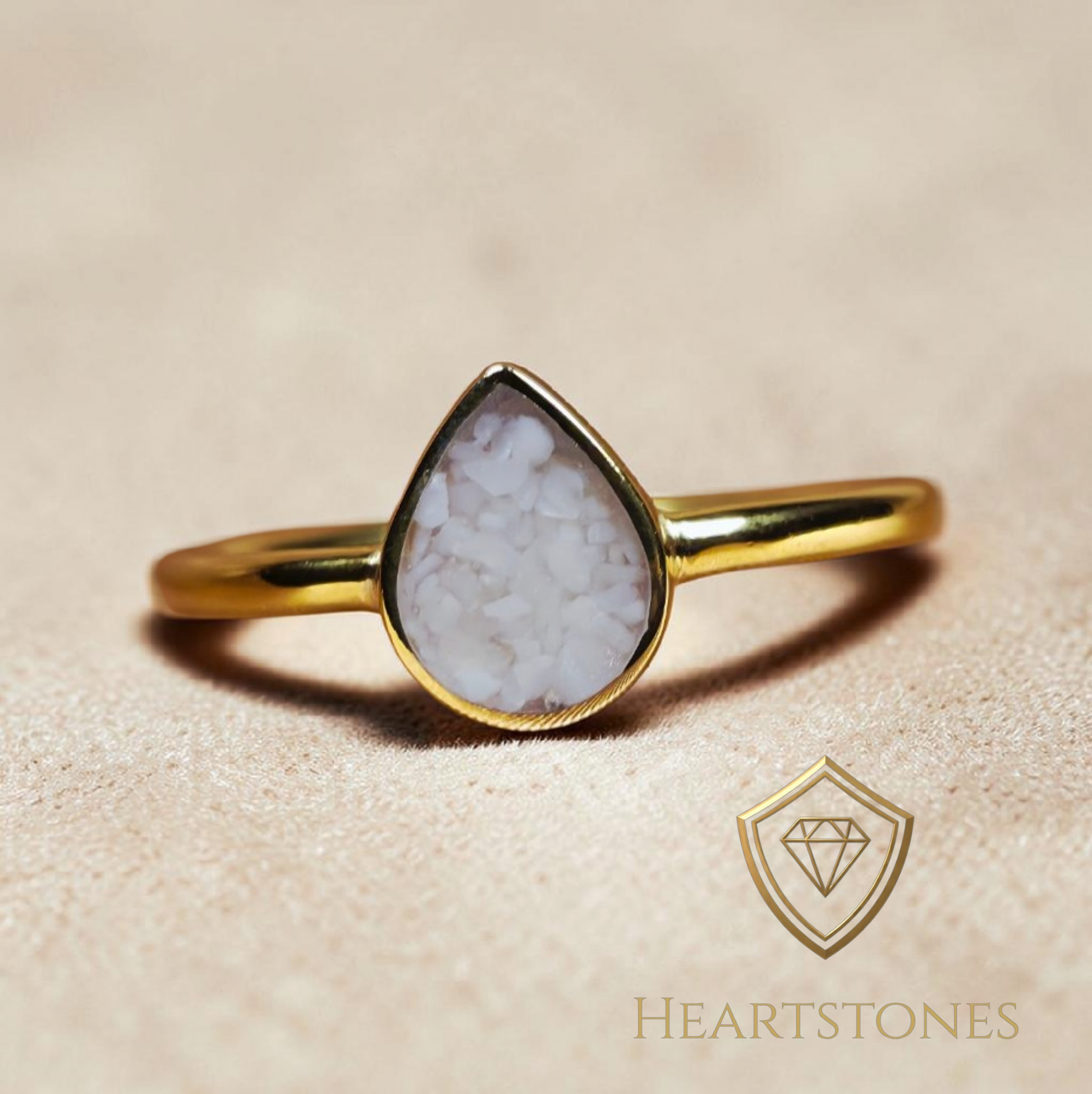 “Gold teardrop memorial ring with pure ash inlay, flush set and meticulously finished by hand by Heartstones®”