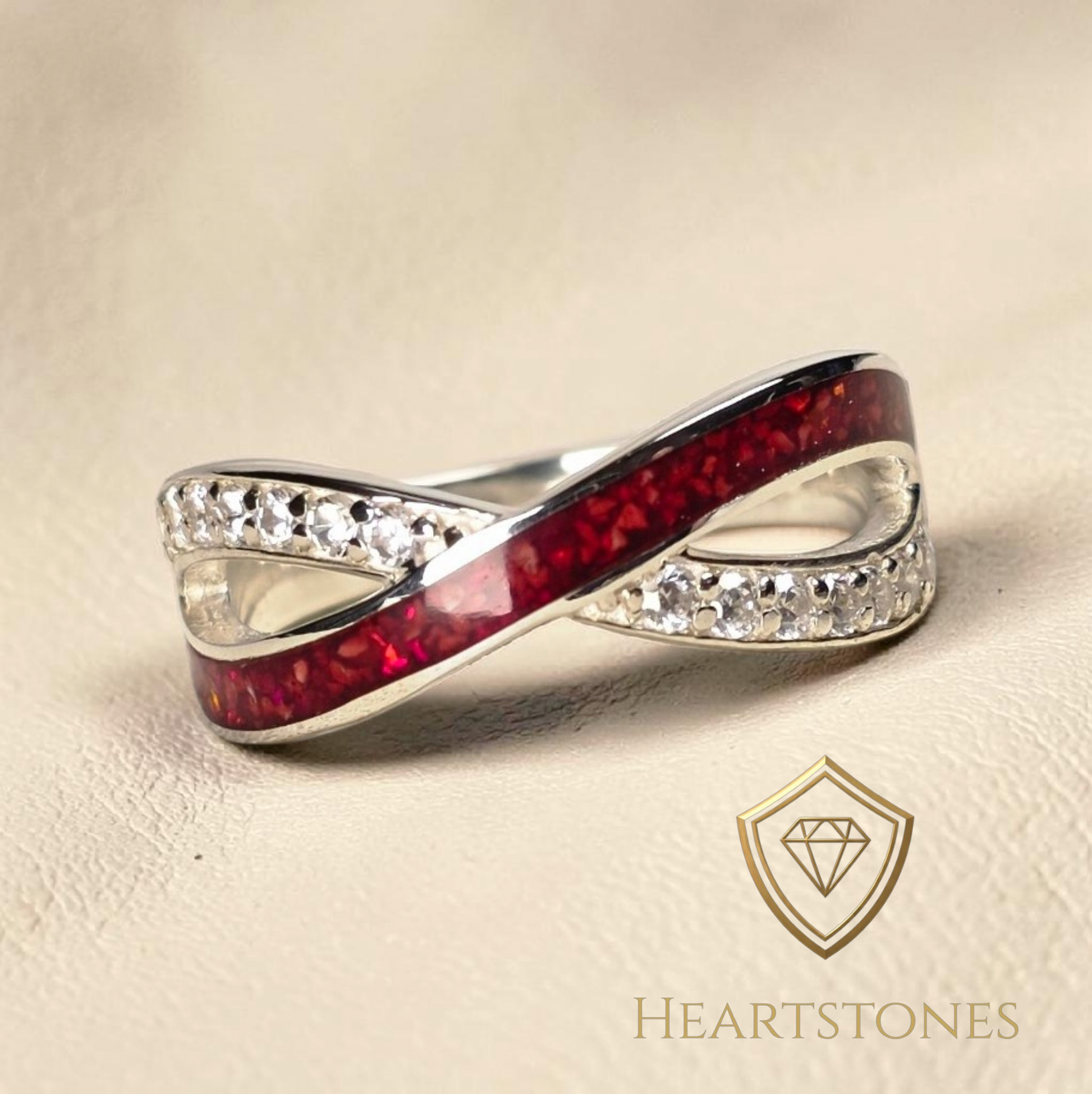 “Sterling silver infinity memorial ring with red ash inlay and pavé set stones, meticulously finished by hand by Heartstones®”