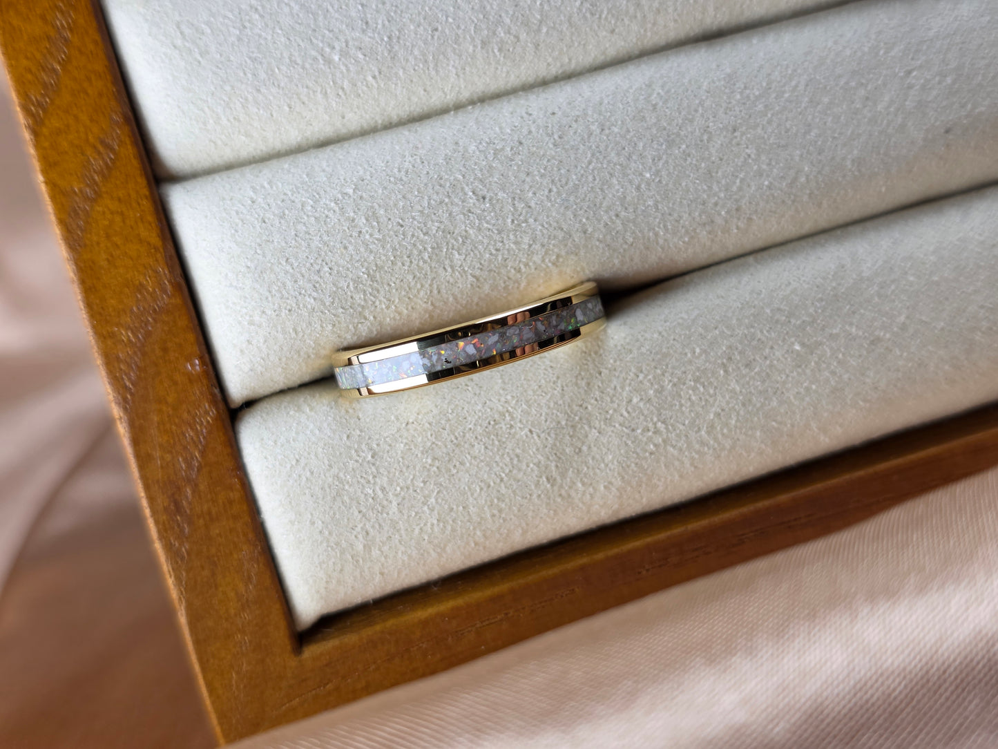 “Gold memorial band ring with opal and ash inlay, flush set and meticulously finished by hand by Heartstones®”
