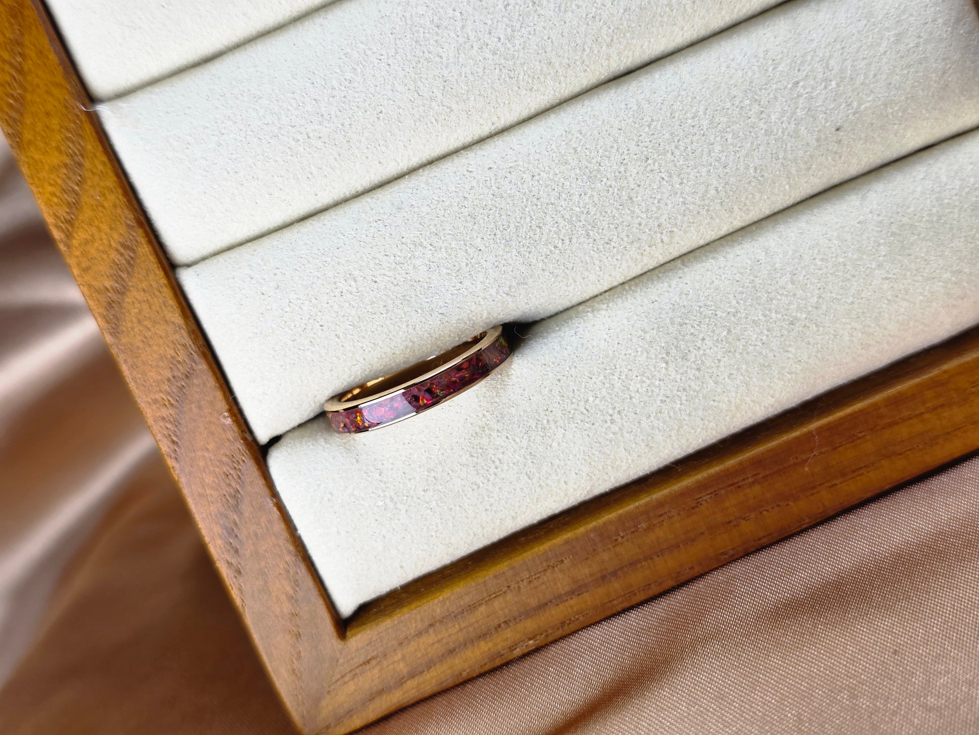 “Gold memorial band ring with red opal and ash inlay, flush set and meticulously finished by hand by Heartstones®”