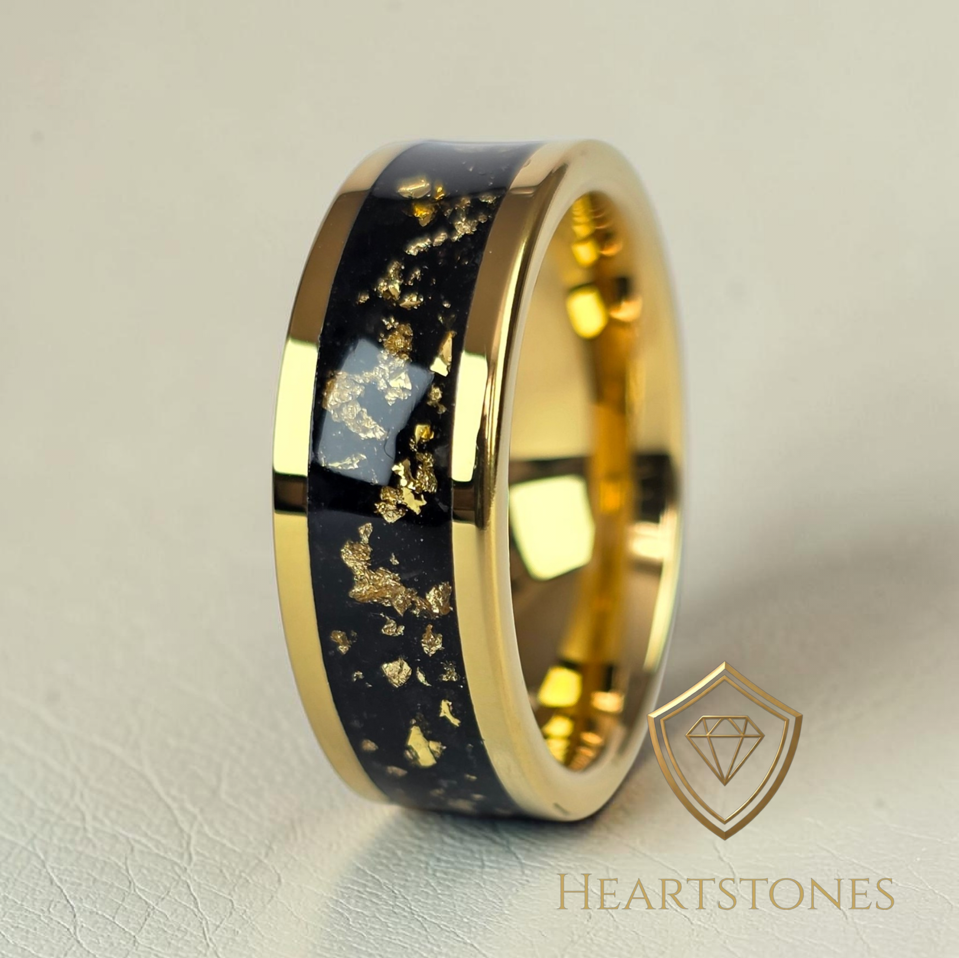 “Gold memorial band ring with black onyx and gold leaf inlay, flush set and meticulously finished by hand by Heartstones®”
