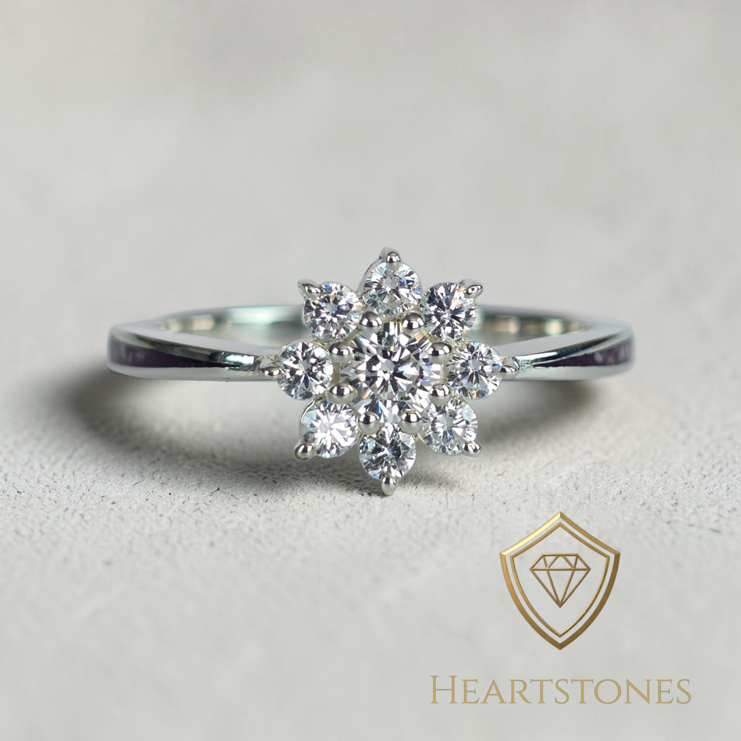 “Sterling silver floral cluster ring with round brilliant stones, meticulously finished by hand by Heartstones®”