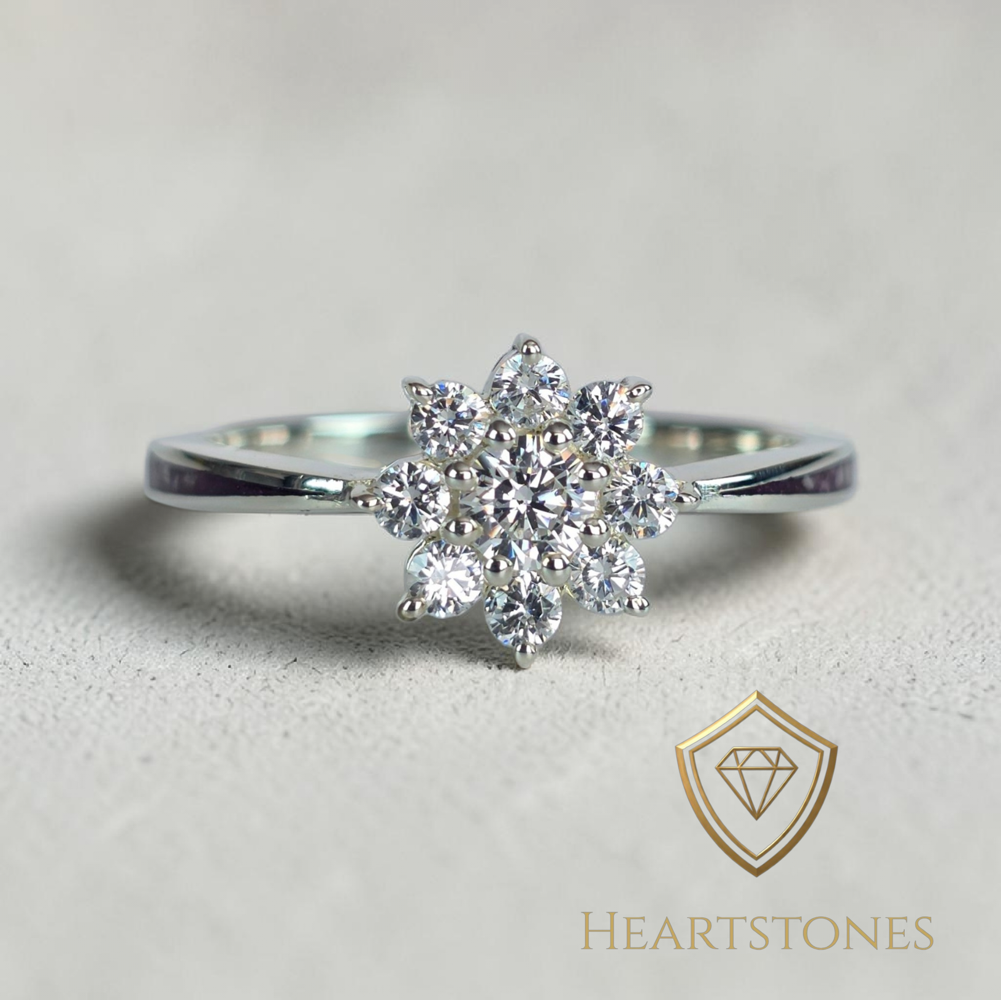 “Sterling silver floral cluster ring with round brilliant stones, meticulously finished by hand by Heartstones®”