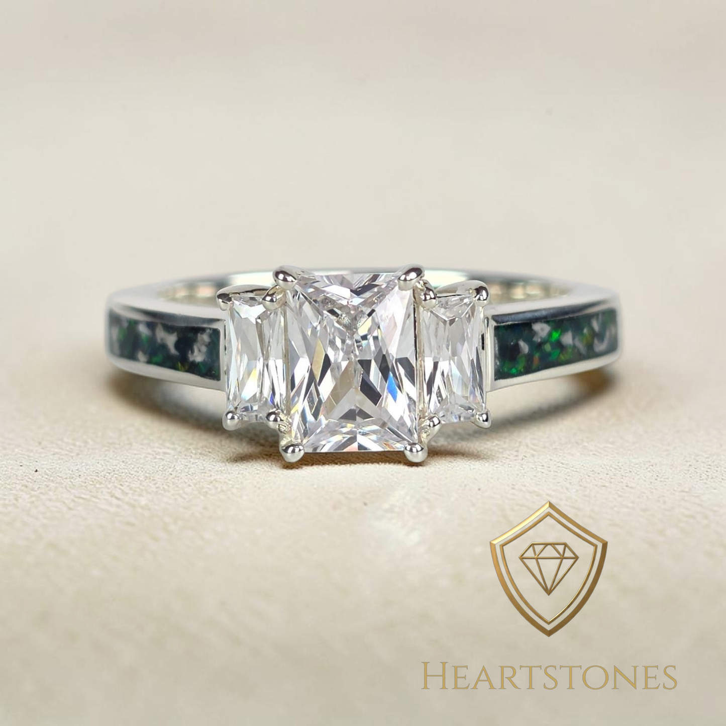 “Sterling silver memorial ring with emerald cut centre stone and green opal ash inlay band, meticulously finished by hand by Heartstones®”