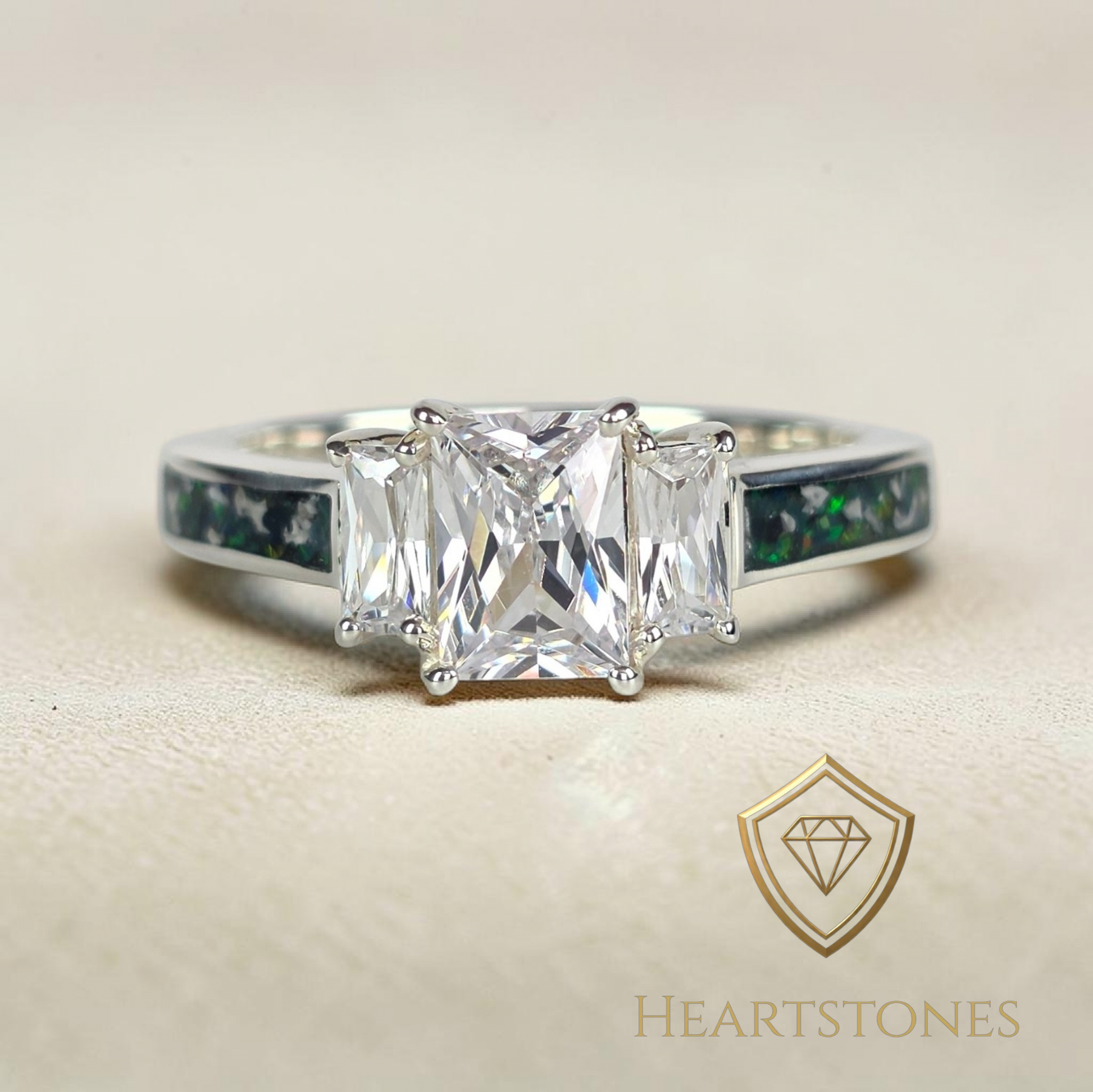 “Sterling silver memorial ring with emerald cut centre stone and green opal ash inlay band, meticulously finished by hand by Heartstones®”