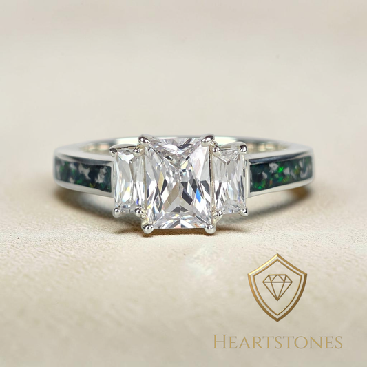 “Sterling silver memorial ring with emerald cut centre stone and green opal ash inlay band, meticulously finished by hand by Heartstones®”