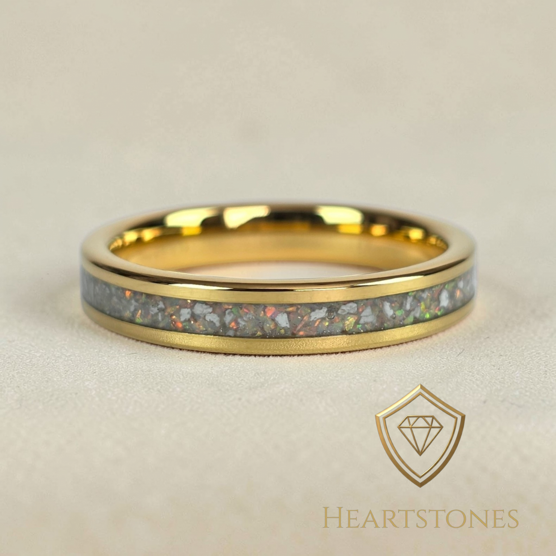 “Gold memorial band ring with ash and opal inlay, flush set and meticulously finished by hand by Heartstones®”