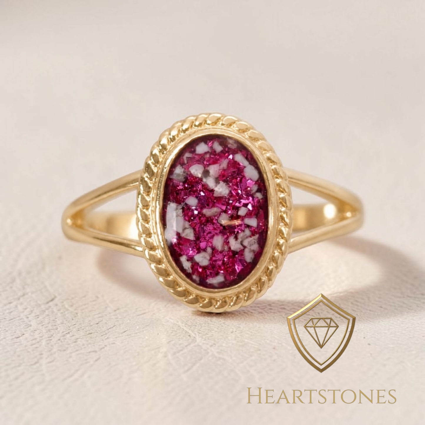 “Gold memorial ring with oval ash and pink opal inlay in rope bezel setting, meticulously finished by hand by Heartstones®”