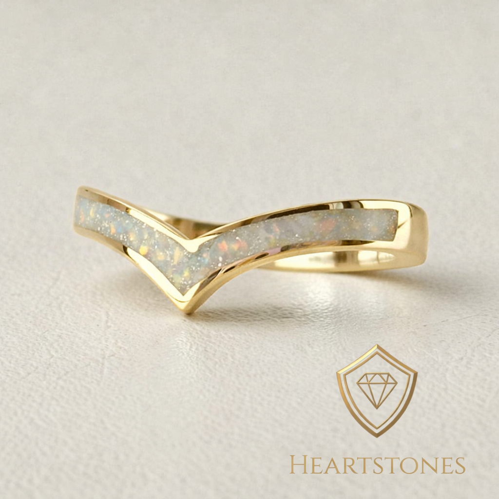 “Gold wishbone memorial ring with opal and ash inlay, flush set and meticulously finished by hand by Heartstones®”