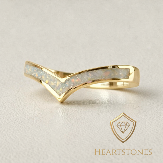 “Gold wishbone memorial ring with opal and ash inlay, flush set and meticulously finished by hand by Heartstones®”