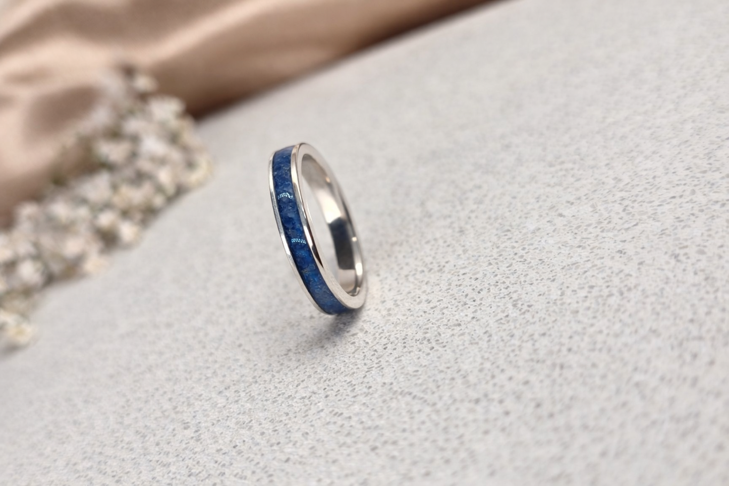 “Sterling silver memorial band ring with blue ash inlay, flush set and meticulously finished by hand by Heartstones®”