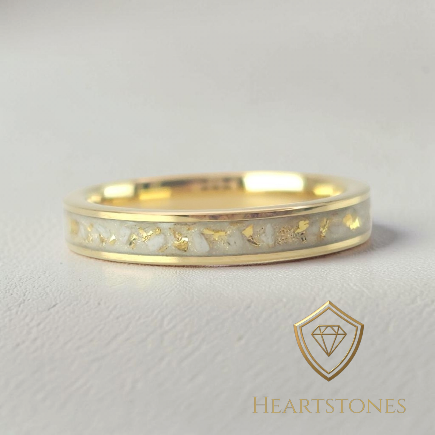 “Gold memorial band ring with white ash and gold leaf inlay, flush set and meticulously finished by hand by Heartstones®”