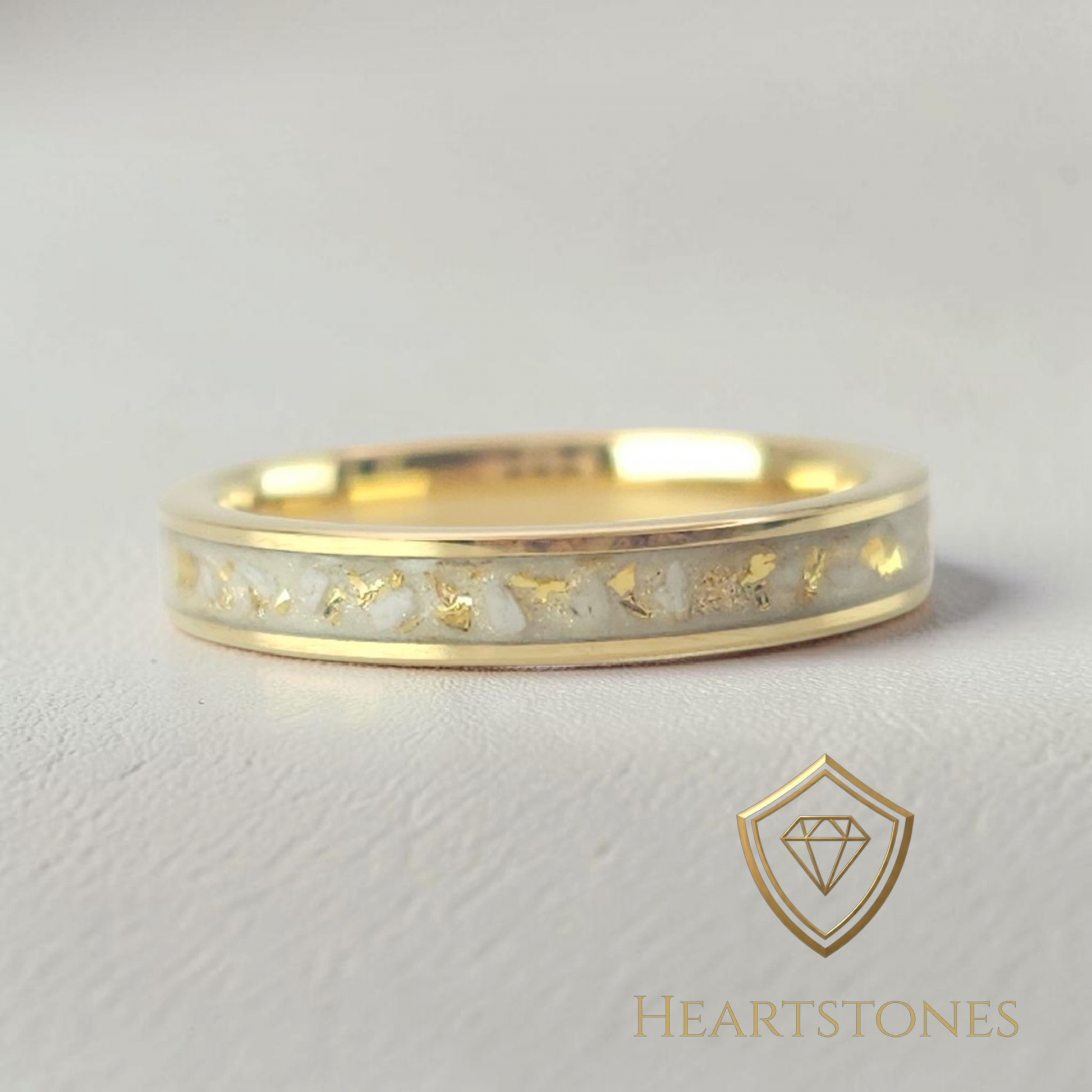 “Gold memorial band ring with white ash and gold leaf inlay, flush set and meticulously finished by hand by Heartstones®”