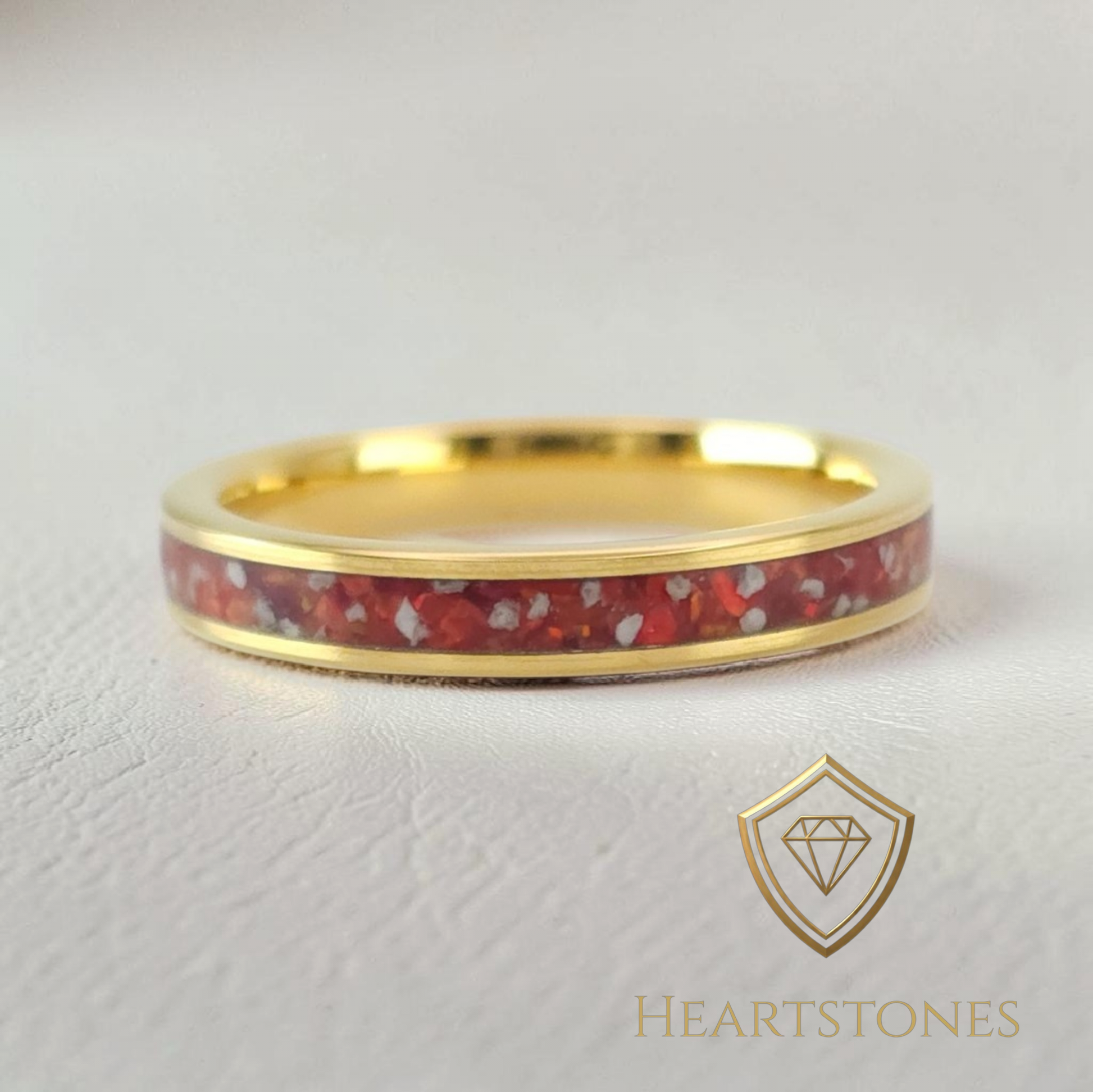 “Gold memorial band ring with red ash inlay, flush set and meticulously finished by hand by Heartstones®”