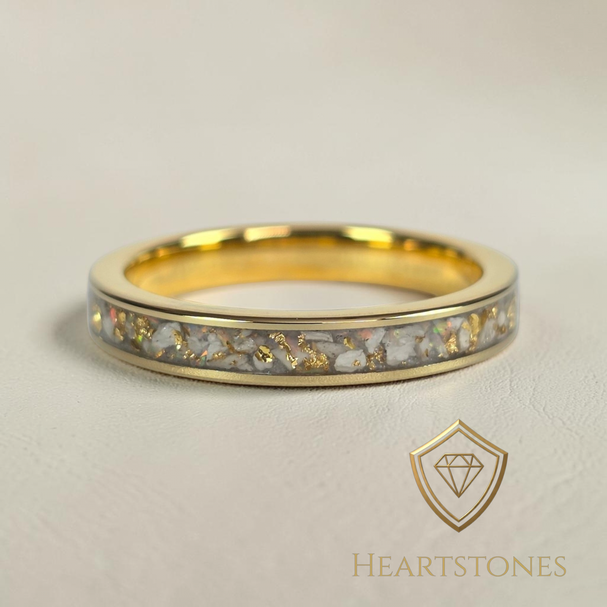 “Gold memorial band ring with white ash and gold leaf inlay, flush set and meticulously finished by hand by Heartstones®”